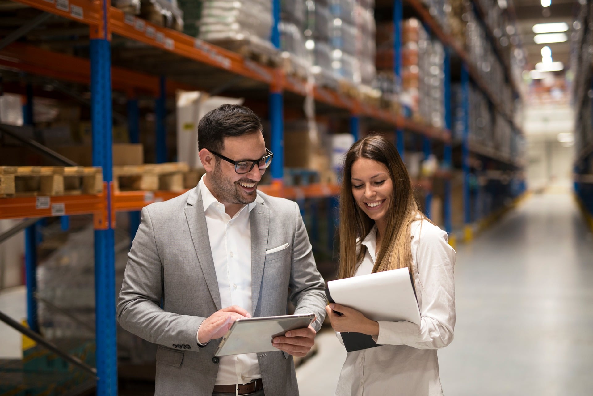 Auditors reviewing documents on the shop floor